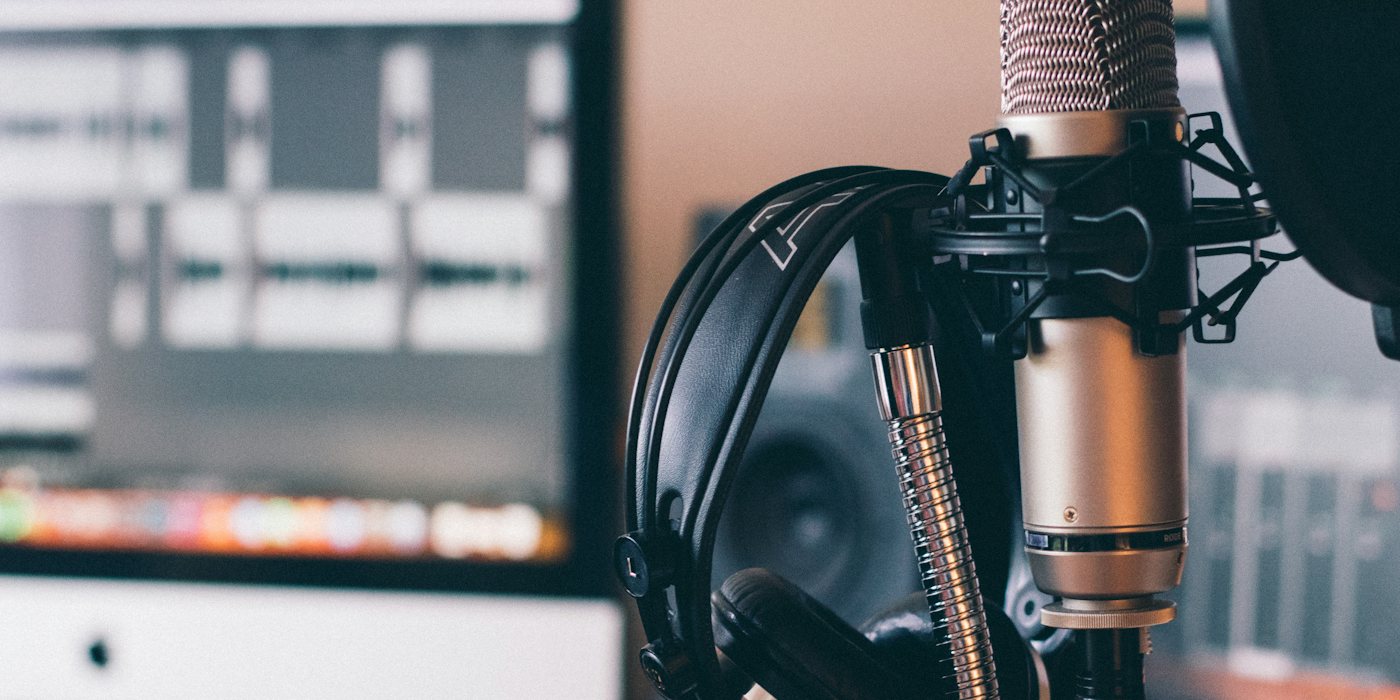 black and silver headphones on black and silver microphone
