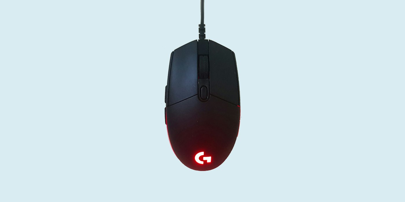 A black gaming mouse with a red glowing logo on a pale blue background